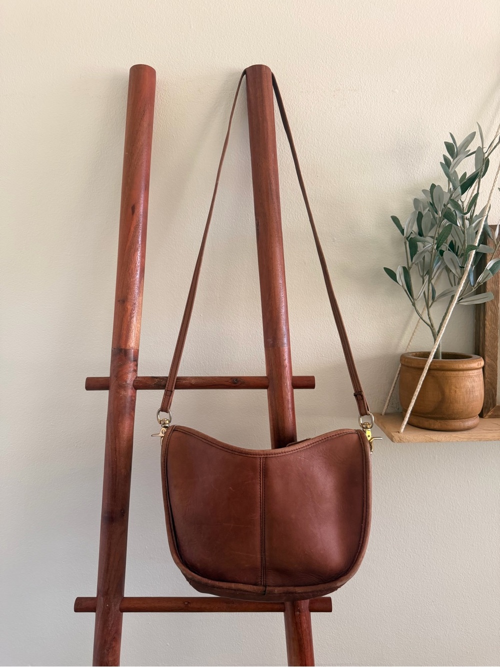 Vintage leather crescent crossbody bag